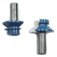 Pair of McJING Tools V-Notch Tongue and Groove Bits for woodworking, showing the cutting edges and V-shaped notches.