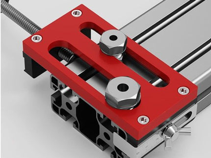 Aluminum extrusion drilling jig for 20/30/40 series by McJING Tools, shown mounted on a metal extrusion for precise drilling.